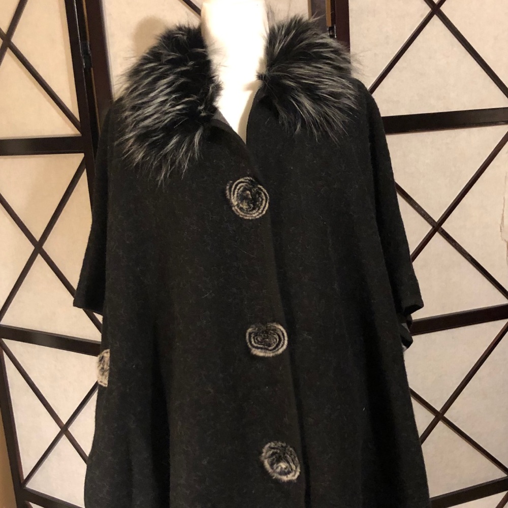 Black winter poncho with faux fur lining.